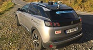 Vehicle on side of road with sensors on roof